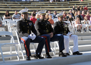 Maj. Gen. Mark Clark sits with MARSOC Marines during a 9/11 ceremony.