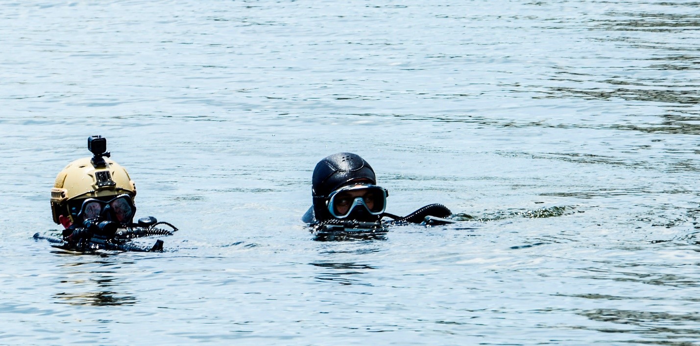 Two Navy SEALs surface before boarding a cruise ship in Tampa