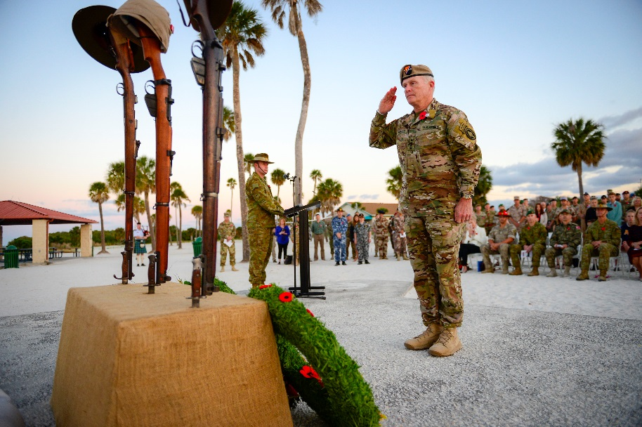 U.S. Army Gen. Raymond A. Thomas III, commander U.S. Special Operations Command, salutes after placing a wreath on a memorial.