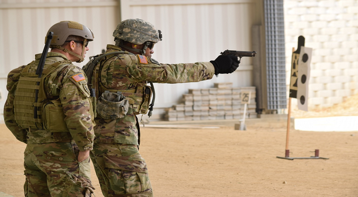 SOCKOR service member preforming weapons training.