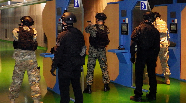 SOCKOR service members preforming weapons training.