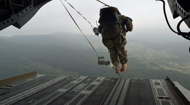 Paratrooper about to jump out of a plane.