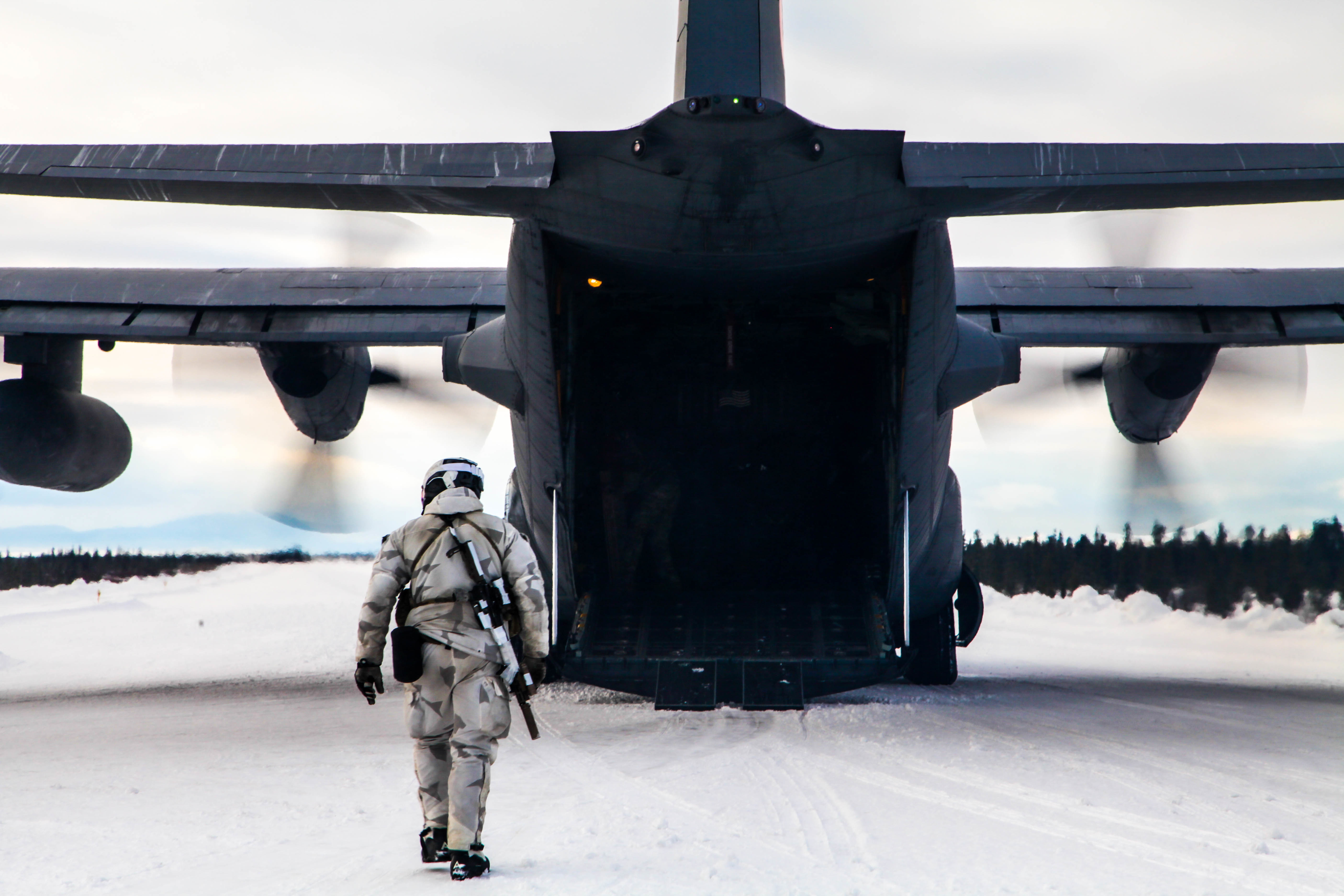 10th SFG (A) operator walks towards open C-17 ramp